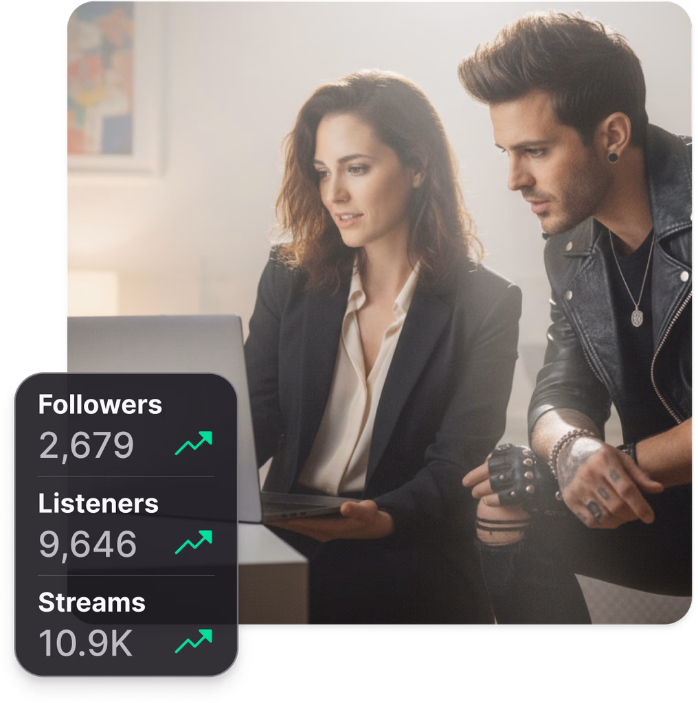 Artist smiling with headphones on, working on music